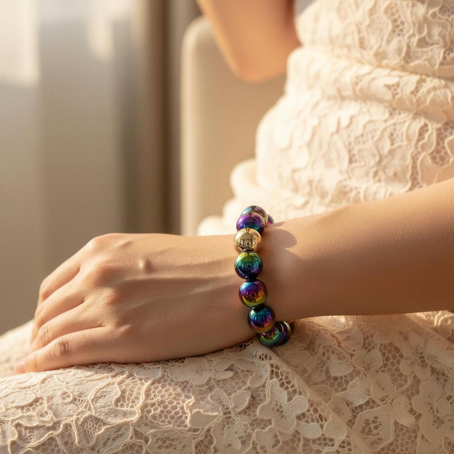 The Velvet Plum Bracelet on a person's wrist with a blurred background
