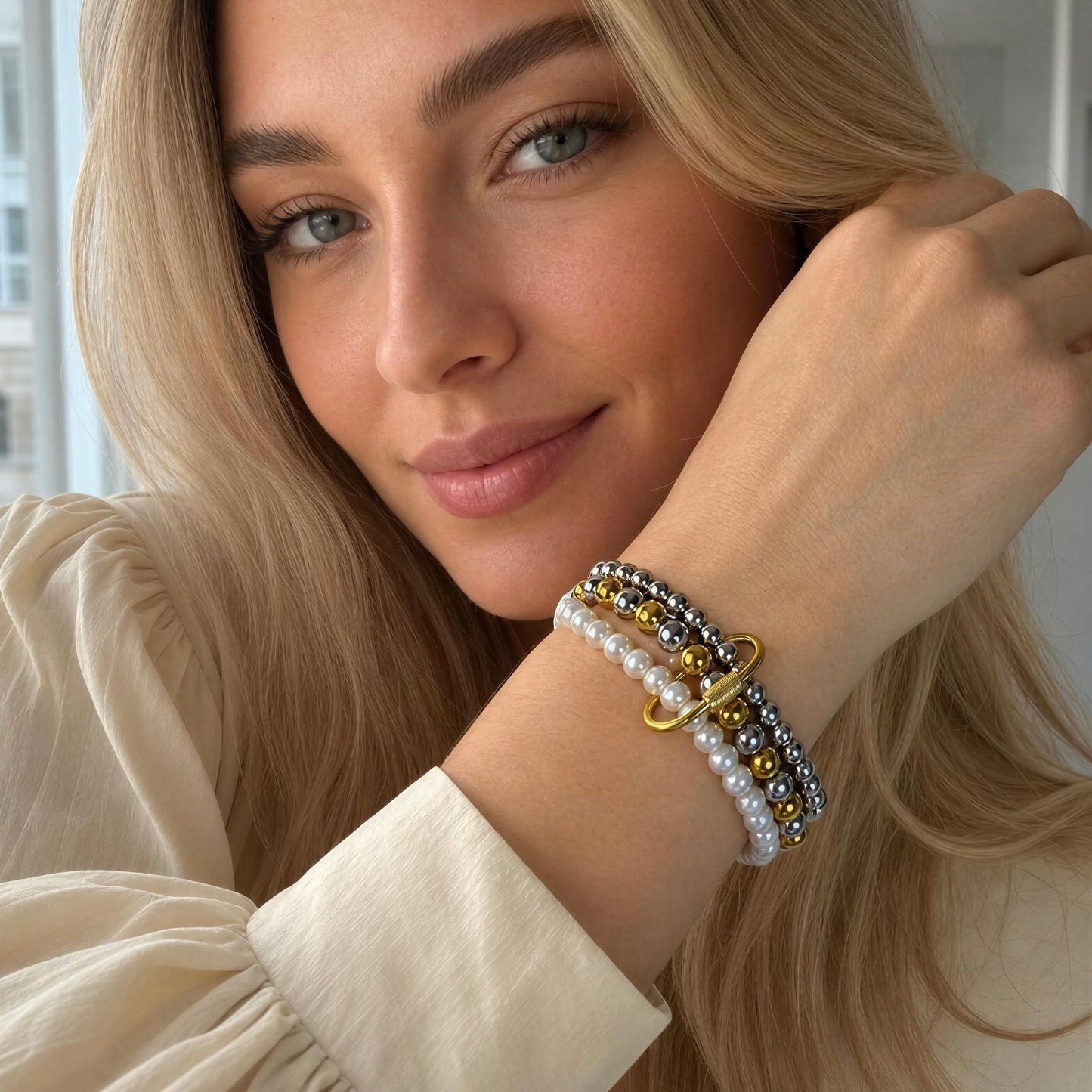 Model wearing the Trio Radiance Bracelet in indoors by window 
