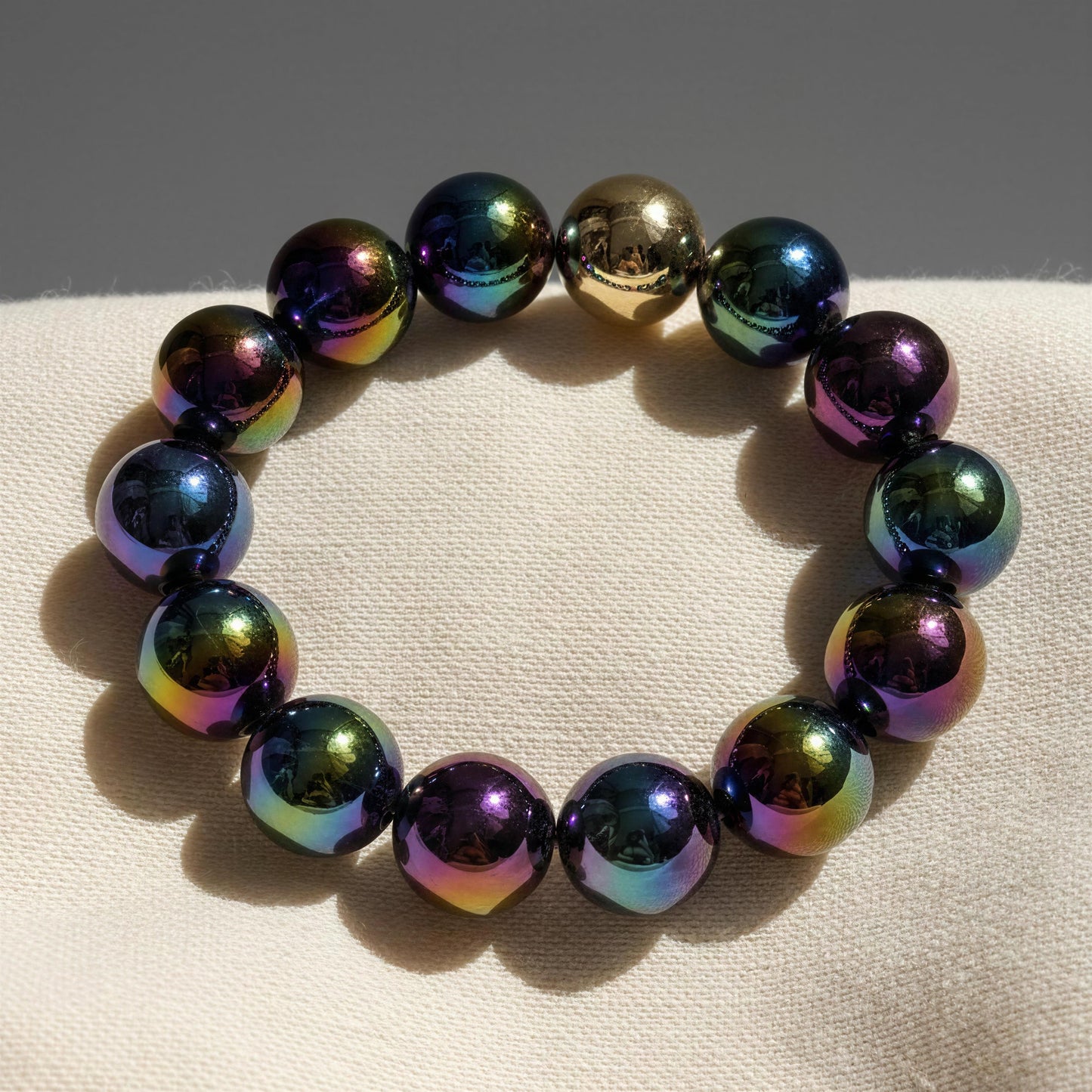 Multicolored beaded bracelet on a beige surface