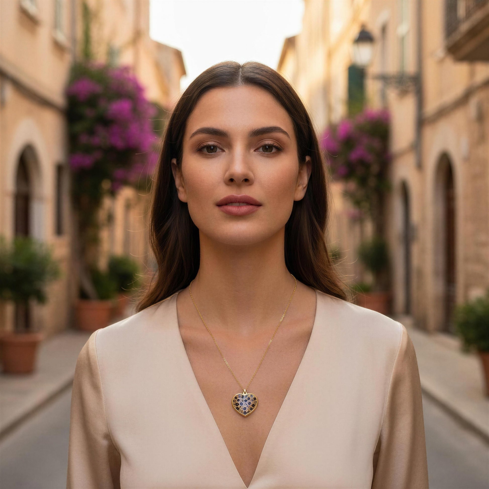 Woman wearing the Wildheart Necklace with a heart-shaped pendant in an Italian street setting